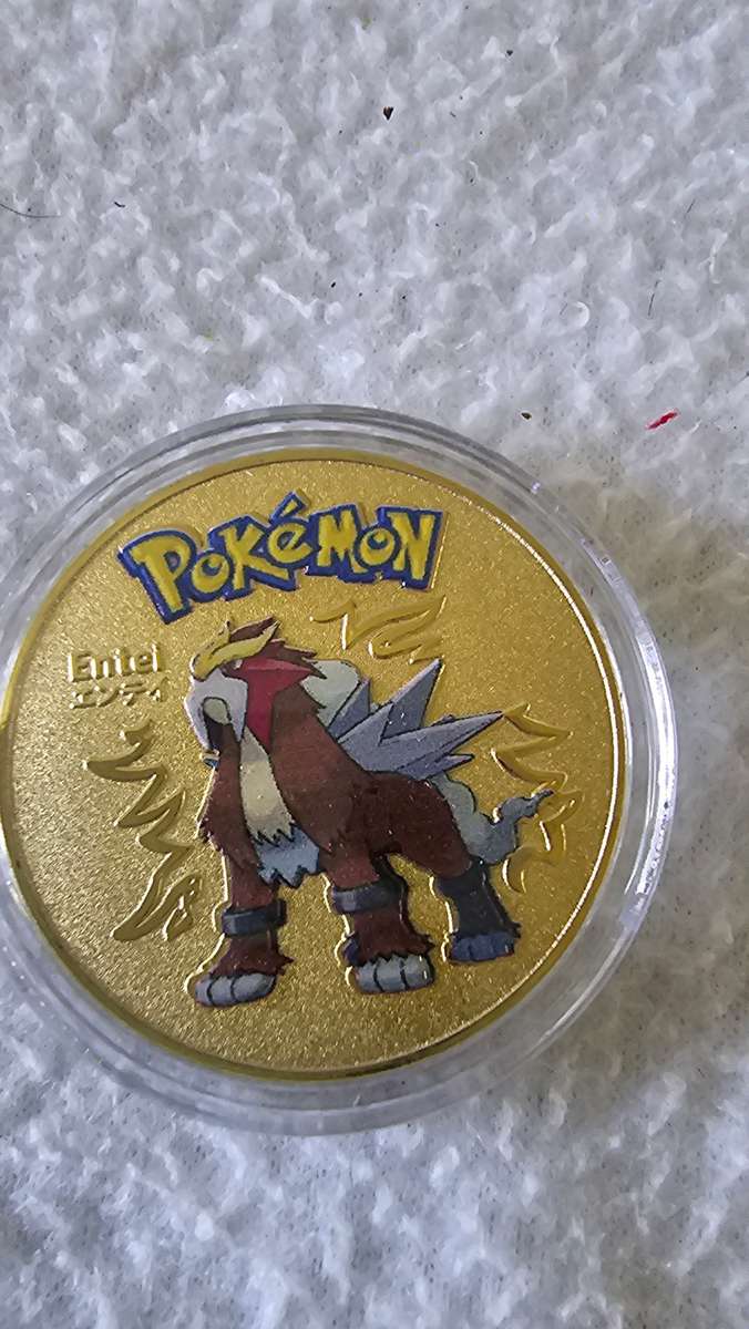 24K GOLD POKEMAN NOTE AND A POKEMAN COIN