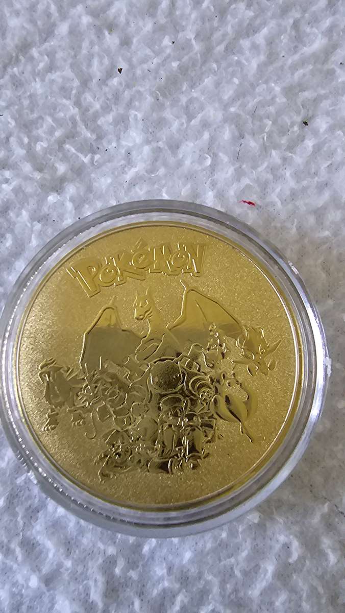 24K GOLD POKEMAN NOTE AND A POKEMAN COIN
