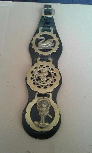 VINTAGE BRASS ITEMS ON LEATHER BELT