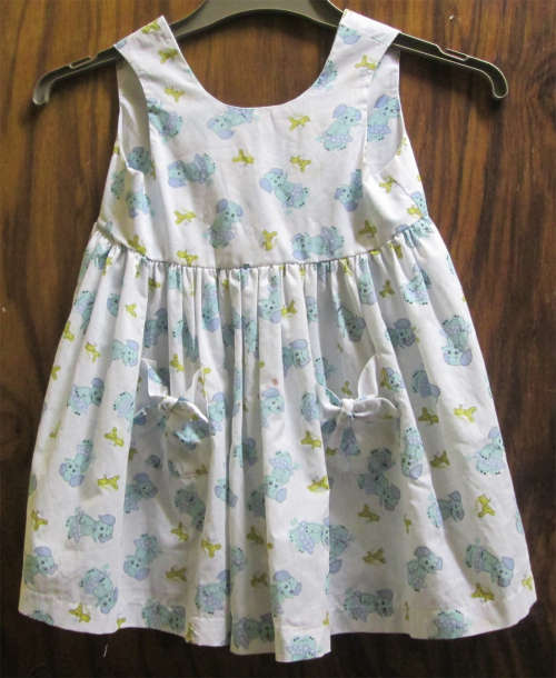 White Dress with Little Blue Elephants & Yellow Teddies (+-2 Years)
