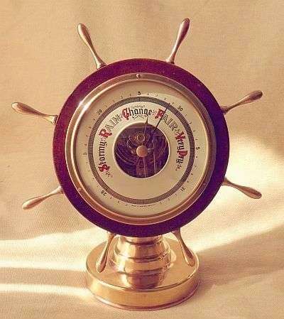 MID CENTURY SHIPS WHEEL BAROMETER WITH BRASS STAND WESTERN GERMANY VERY GOOD CONDITION WORKING