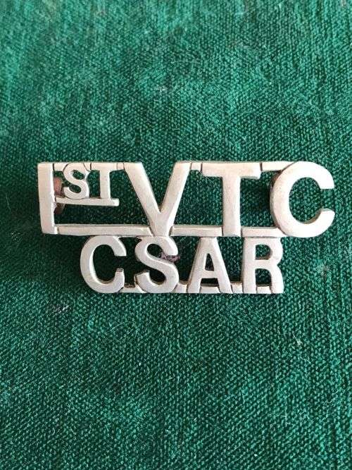 1ST VOLUNTEER CORPS-CENTRAL SOUTH AFRICAN RAILWAYS,WHITE METAL TITLE -WORN 1902-1906- 2 LUGS