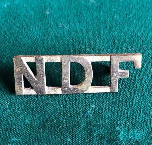NYASSALAND DEFENCE FORCE SHOULDER TITLE BRASS- WW2-STRIKING- 2 LUGS