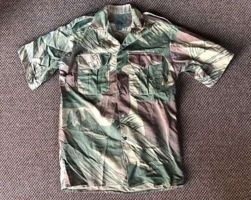 RHODESIA CAMO SHORT SLEEVE SHIRT SIZE MEDIUM-MEASURES 50 CM ARMPIT TO ARMPIT-SOME DAMAGE PLEASE LOOK