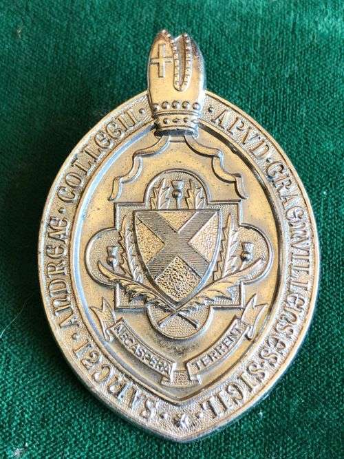 VINTAGE SAINT ANDREWS COLLEGE CADET CORPS WHITE METAL CAP BADGE- 2 LUGS-MEASURES 60X40 MM