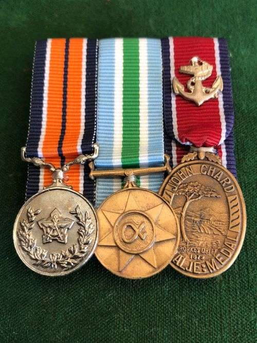 SADF GROUP OF THREE MINIATURE MEDALS ATTRIBUTED TO PO M. WALTER. JOHN CHARD MEDAL WITH NAVY DEVICE O