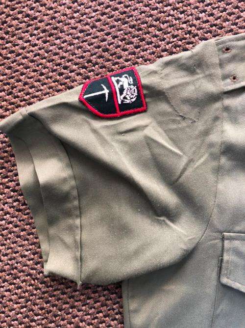 RHODESIAN OLIVE GREEN SHIRT WITH PATCHES AND MAKERS LABEL-SIZE LARGE-MEASURES 55 CM ARMPIT TO ARMPIT