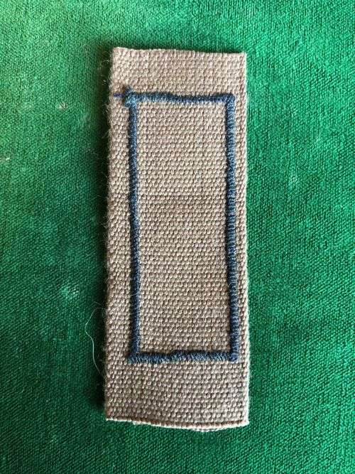 SADF PERIOD MARKSMAN BADGE PRINTED ON NUTRIA WITH EMBROIDERED BORDER AROUND RIFLE