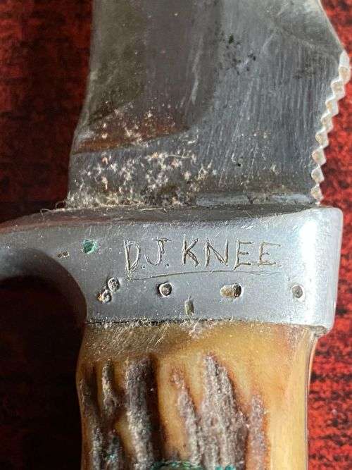 PUMA WHITE HUNTER KNIFE-STAGHORN SHARPENED SECTION ON TOP EDGE AND 1 INCH SERRATED SECTION ON BOTTOM