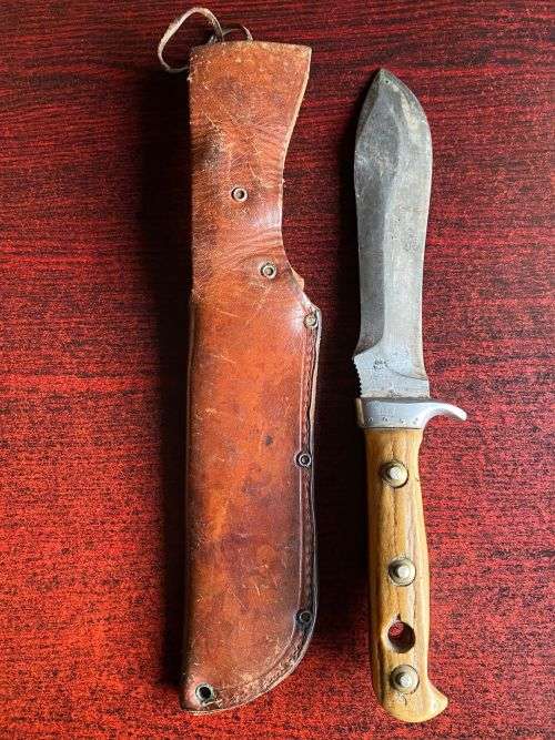 PUMA WHITE HUNTER KNIFE-STAGHORN SHARPENED SECTION ON TOP EDGE AND 1 INCH SERRATED SECTION ON BOTTOM