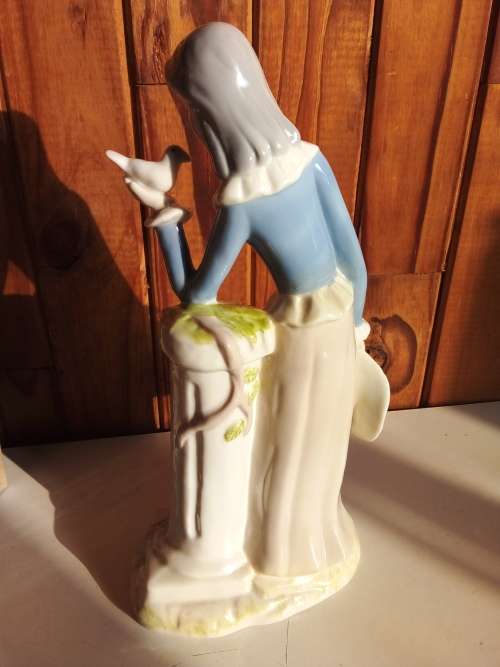 Lady with Bird Glazed Porcelain Figurine