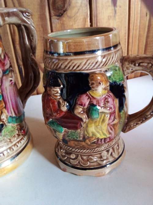 Two Tankards with Raised Detail for One Bid