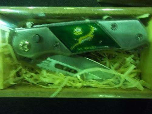 WOW (SPRING BOK ) POCKET KNIFE  COLLECTION IN HOLDER RAP NOT USE