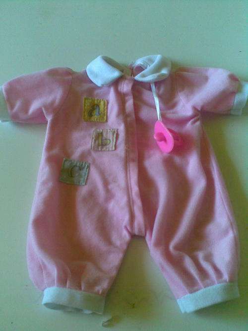 Variety of diffrent doll cloths and accessories, including carrier. ***Postage only R30***