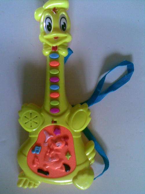 Donald Duck button Guitar,  Plays all difftent nursery Rymes and songs, with shoulder strap