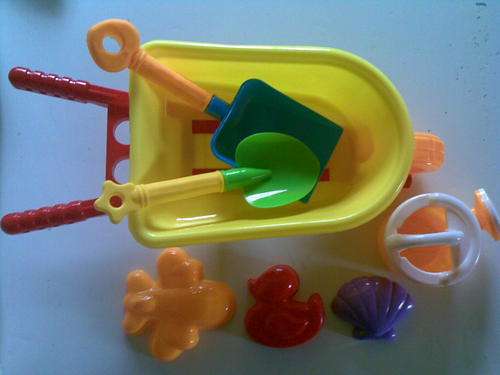 Large Wheelbarrow with sandpit toys, spades and watering can. Ideal for the beach or outdoor play!!