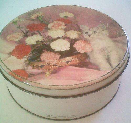 Very old round cake tin with cat on the front