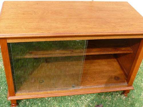 Teak cabinet with sliding glass doors