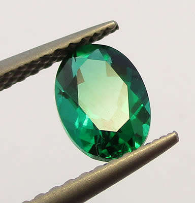 Emerald Simulant. Lab created Gemstone . 7x5mm Oval