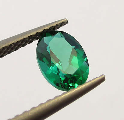 Emerald Simulant. Lab created Gemstone . 7x5mm Oval