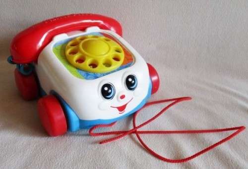 CUTE FISHER PRICE PULL-ALONG PHONE WITH RINGING, ROTARY DIAL AND MOVING EYES!!
