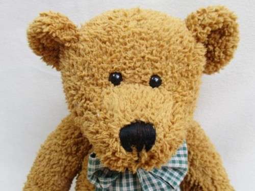 A VERY COLLECTABLE SUNKID, GERMANY WITH ORIGINAL BUTTON AND DROP STITCH NOSE!!