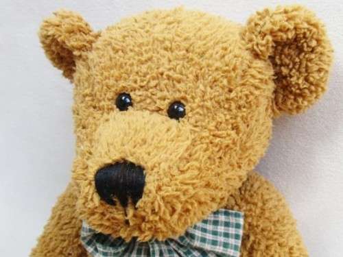 A VERY COLLECTABLE SUNKID, GERMANY WITH ORIGINAL BUTTON AND DROP STITCH NOSE!!