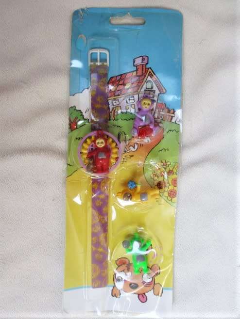 FOUR SWEET TINY VINTAGE TELETUBBIES AND WATCH STILL SEALED IN ORIGINAL PACKAGE!!