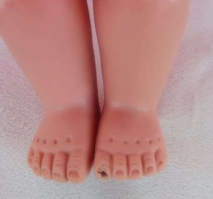 A LOVELY VINTAGE DOLL WITH A SWEET INNOCENT FACE - MARKED 'SAD' ON BACK OF HEAD