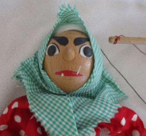 A VINTAGE WOODEN PUPPET