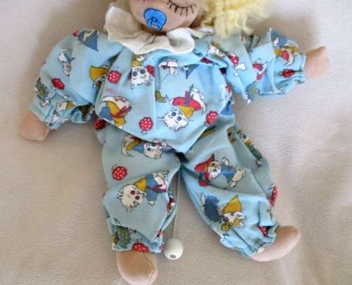 A SWEET VINTAGE MUSICAL PULL-STRING BABY DOLL IN CUTE KITTEN PJ's