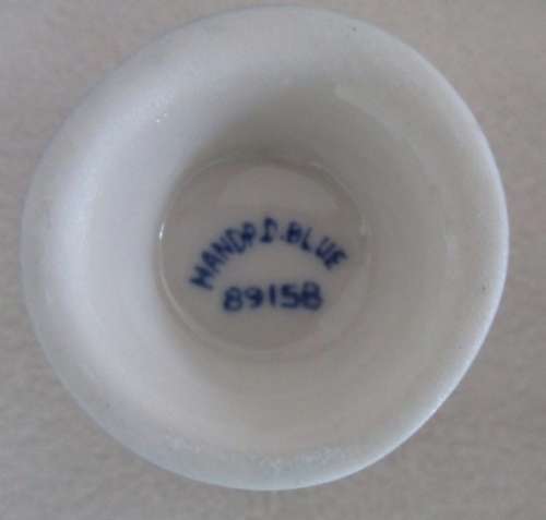 SET OF FOUR VINTAGE HAND PAINTED DELFT EGG CUPS WITH WALL MOUNTED WOODEN STAND