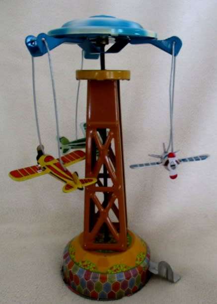COLLECTABLE RETRO TOYCOMET WIND-UP/LEVER TIN AIRPLANE CAROUSEL WITH BOX