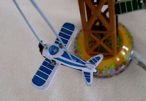 COLLECTABLE RETRO TOYCOMET WIND-UP/LEVER TIN AIRPLANE CAROUSEL WITH BOX