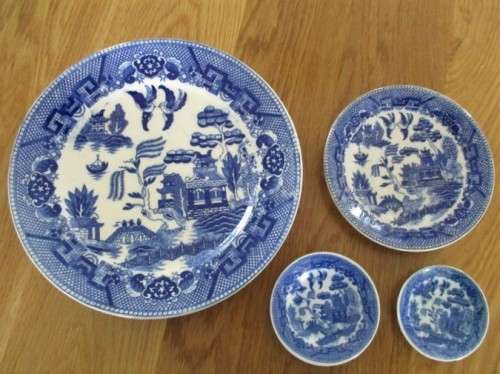 FOUR DIFFERENT-SIZED BLUE AND WHITE WILLOW PATTERN PLATES (TWO MARKED JAPAN) - NICE DISPLAY!