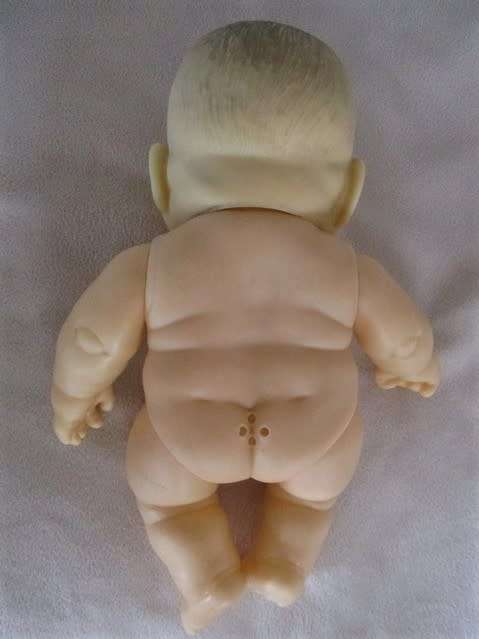 A RATHER DIFFERENT SMALL CHUBBY BABY DOLL