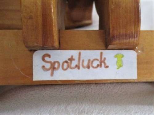 A VINTAGE 51CM LONG WOODEN DACHSHUND PULL-ALONG WITH MOVEABLE BODY