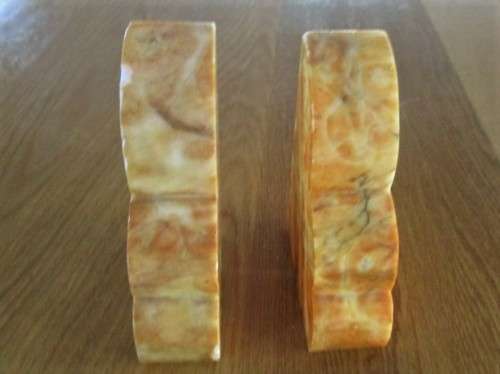 A PAIR OF HEAVY AMBER HONEY ONYX? BOOKENDS
