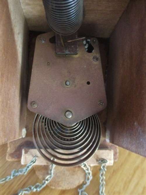 A SMALL VINTAGE NOVELTY CLOCK WITH GERMAN FRAULEIN ON SWING - WORKING???