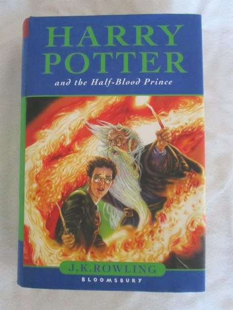 RARE HARRY POTTER FIRST EDITION WITH MISPRINT ON PAGE 99 (ELEVEN OWLS) - HARD COVER PLUS DUST COVER