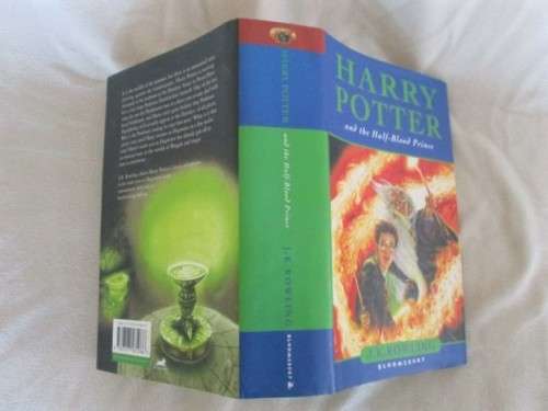 RARE HARRY POTTER FIRST EDITION WITH MISPRINT ON PAGE 99 (ELEVEN OWLS) - HARD COVER PLUS DUST COVER