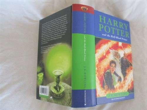 RARE HARRY POTTER FIRST EDITION WITH MISPRINT ON PAGE 99 (ELEVEN OWLS) - HARD COVER PLUS DUST COVER
