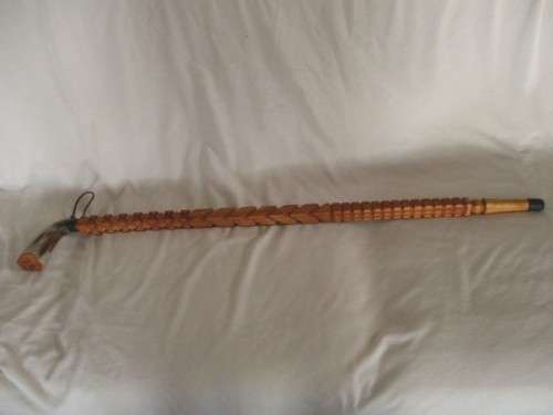 A VINTAGE ORNATELY CARVED, BONE HANDLED WOODEN WALKING STICK