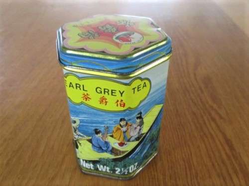 VINTAGE LITHOGRAPHED EARL GREY TEA TIN WITH ORIENTAL BOATING SCENE