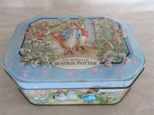 A COLLECTABLE BENTLEY'S OF LONDON TIN WITH RAISED RELIEF DESIGN - THE WORLD OF BEATRIX POTTER