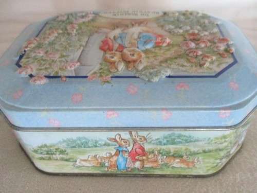 A COLLECTABLE BENTLEY'S OF LONDON TIN WITH RAISED RELIEF DESIGN - THE WORLD OF BEATRIX POTTER