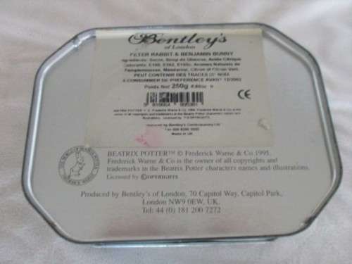 A COLLECTABLE BENTLEY'S OF LONDON TIN WITH RAISED RELIEF DESIGN - THE WORLD OF BEATRIX POTTER