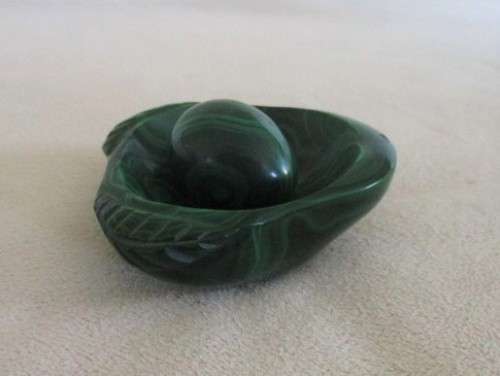 A BEAUTIFUL SMALL MALACHITE EGG IN MALACHITE "NEST"