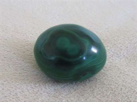 A BEAUTIFUL SMALL MALACHITE EGG IN MALACHITE "NEST"