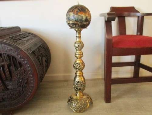 GORGEOUS!! ENORMOUS ORNATE BRASS CANDLE HOLDER WITH CANDLE (COMPARE SIZE TO WINE BOTTLE AND CHAIR)